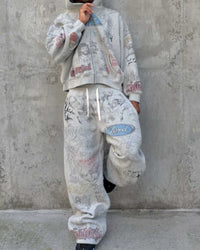 Model wearing Righteous Jesus My Lord grey zip up hoodie with matching sweatpants against a concrete wall