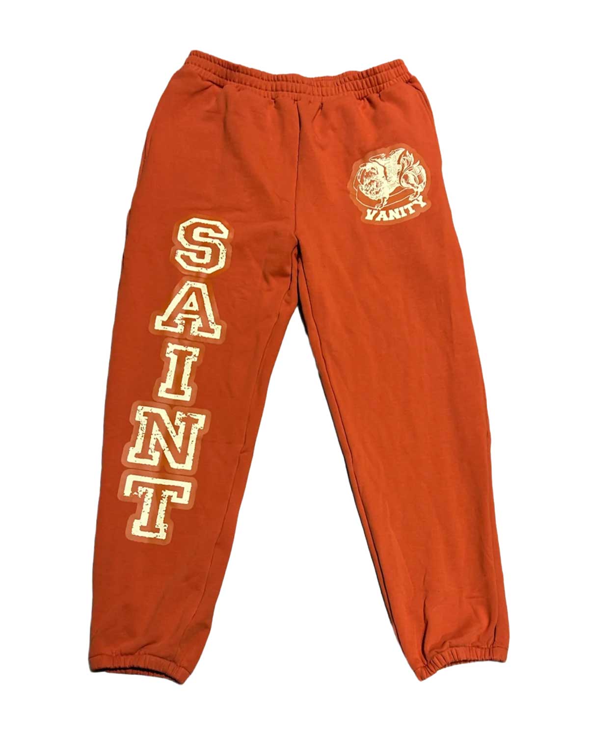 Saint Vanity Saint Love Sweatpants Orange, burnt orange fleece joggers with cream SAINT letters down the leg, front view
