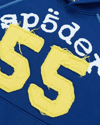 Sp5der 55 University Hoodie navy, close-up of the white Sp5der lettering and distressed yellow 55 appliqué