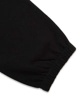 Sp5der Angel Number Beluga Sweatpants black and pink, close-up of the elasticated ankle cuff