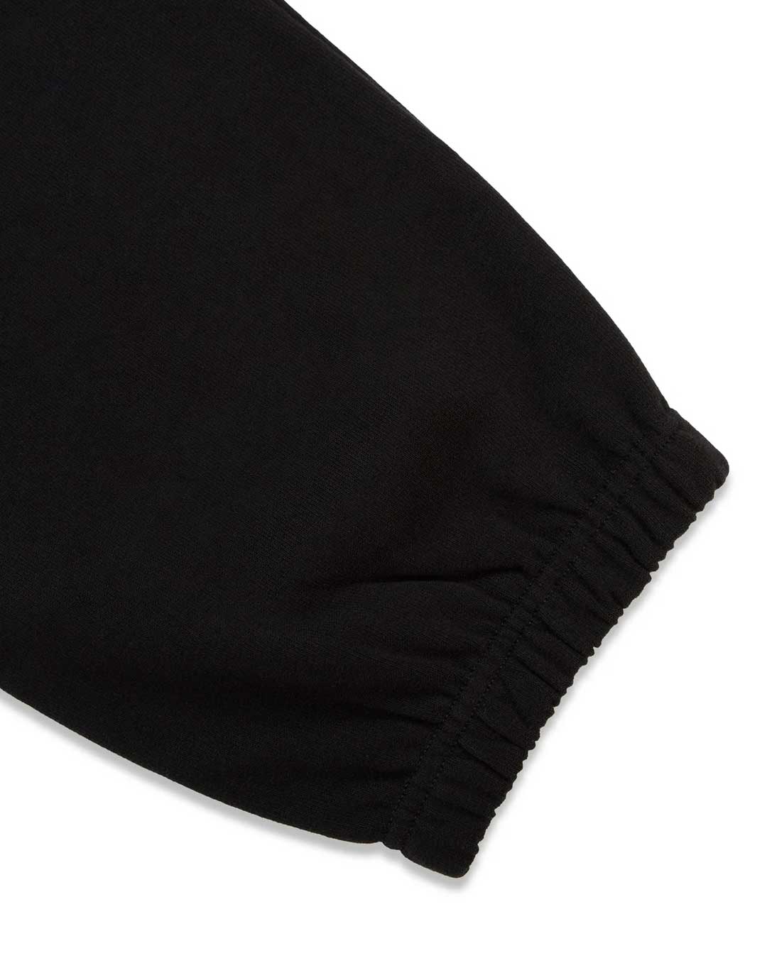 Sp5der Angel Number Beluga Sweatpants black and pink, close-up of the elasticated ankle cuff