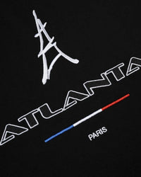 Sp5der Arraignee Tee black, close-up of the Eiffel Tower embroidery, ATLANTA wordmark, tricolour bar and PARIS lettering