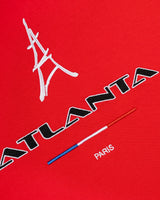 Sp5der Arraignee Tee red, close-up of the Eiffel Tower embroidery, ATLANTA wordmark, tricolour bar and PARIS lettering