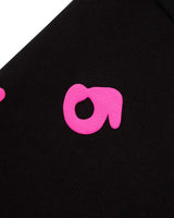 Sp5der Beluga Angel Number Hoodie black and pink, close-up of a single pink numeral printed on the sleeve
