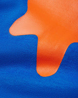Sp5der Beluga Tee blue, close-up of the orange puff-print stars on blue cotton