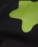 Sp5der Beluga Tee onyx, close-up of the lime green puff-print stars on black cotton
