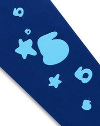 Sp5der Beluga V2 Sweatpants navy/blue, close-up of the puff stars and 5s on the leg