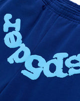 Sp5der Beluga V2 Sweatpants navy/blue, close-up of the light blue puff Sp5der lettering