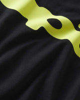 Sp5der Bubble Tee onyx, close-up of the lime-yellow print on black fabric