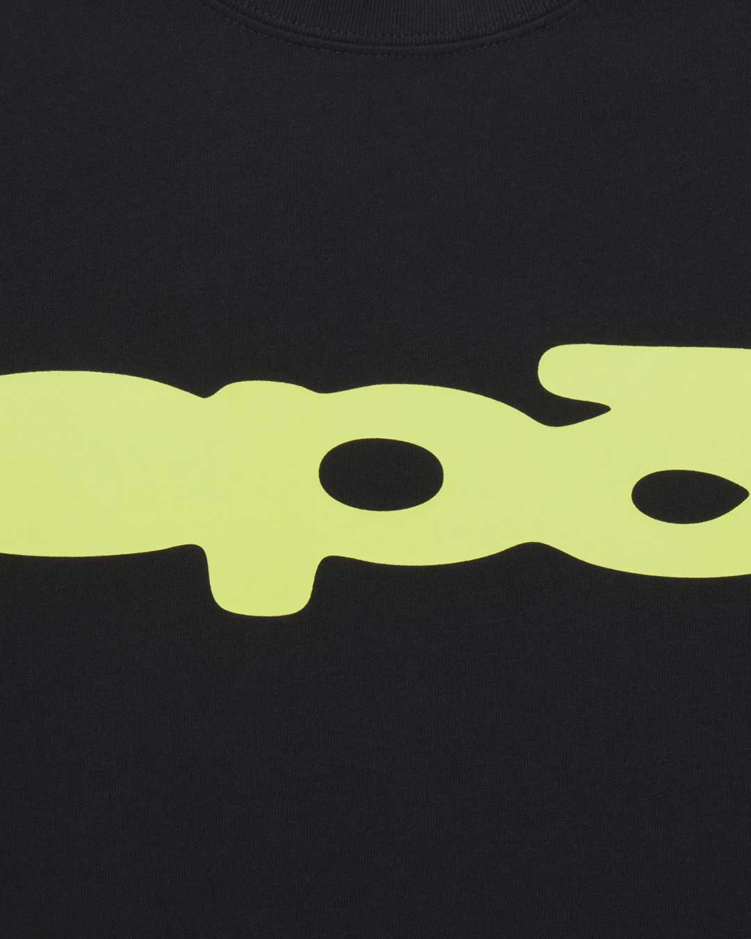 Sp5der Bubble Tee onyx, close-up of the lime-yellow bubble logo print