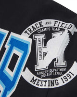 Sp5der Campers Field Zip Up Hoodie onyx, close-up of the collegiate seal patch at the shoulder