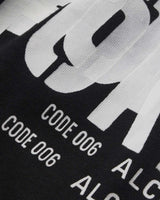 Sp5der Distort Tee onyx, close-up of the distorted lettering and CODE 006 text