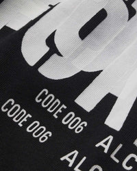 Sp5der Distort Tee onyx, close-up of the distorted lettering and CODE 006 text