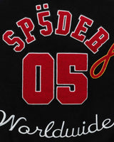Sp5der District Cuntry Varsity Jacket black, close-up of the red chenille SP5DER 05 and Worldwide script on the back