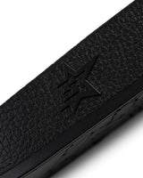 Sp5der Enzo Slide black, close-up of the embossed star on the side of the strap