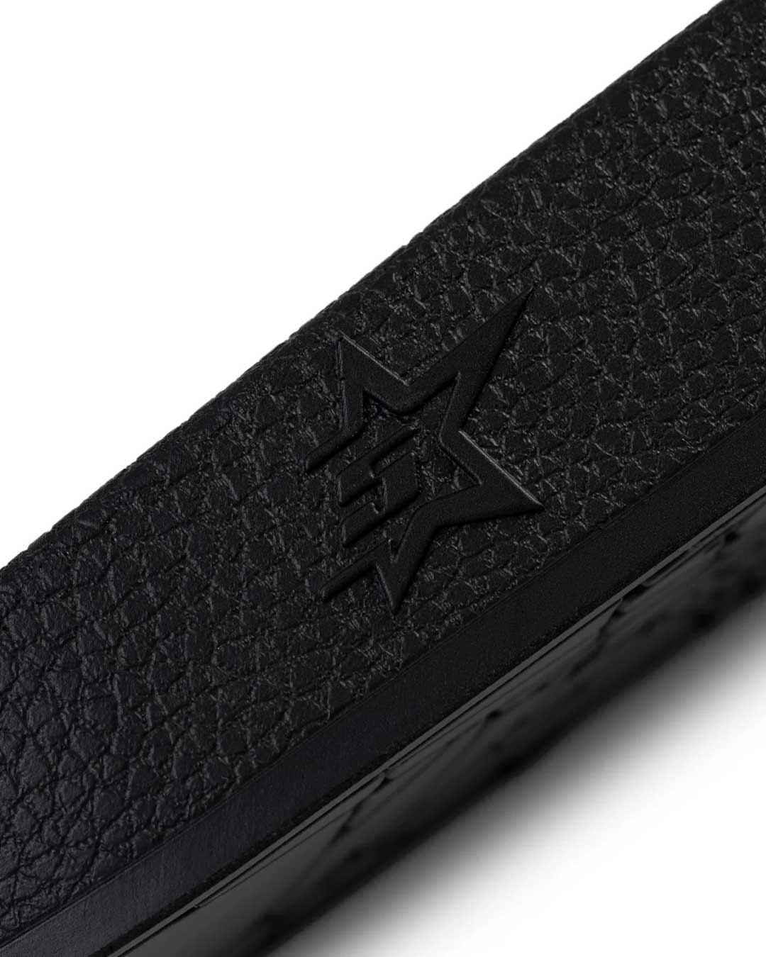 Sp5der Enzo Slide black, close-up of the embossed star on the side of the strap