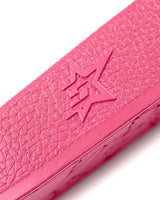 Sp5der Enzo Slide pink, close-up of the embossed star logo on the midsole sidewall