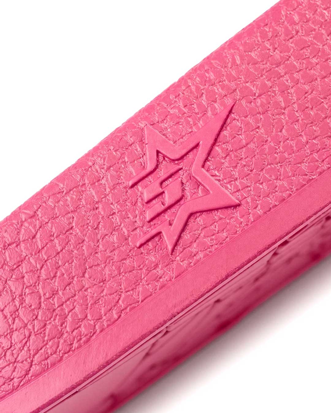 Sp5der Enzo Slide pink, close-up of the embossed star logo on the midsole sidewall