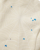 Sp5der Heavy Web Hoodie foam cream, close-up of the tonal web print with blue star accents