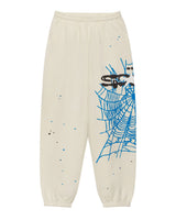 Sp5der Heavy Web Sweatpants foam cream, sweatpants with an oversized blue spiderweb and Sp5der logo, front view