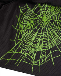 Sp5der Mesh Double Layer Shorts onyx, close-up of the elastic waistband and green sp5der wordmark on black mesh