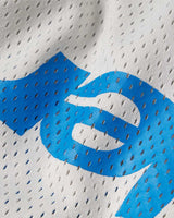 Sp5der Mesh Double Layer Shorts plastic, macro close-up of the blue sp5der wordmark printed on perforated grey mesh