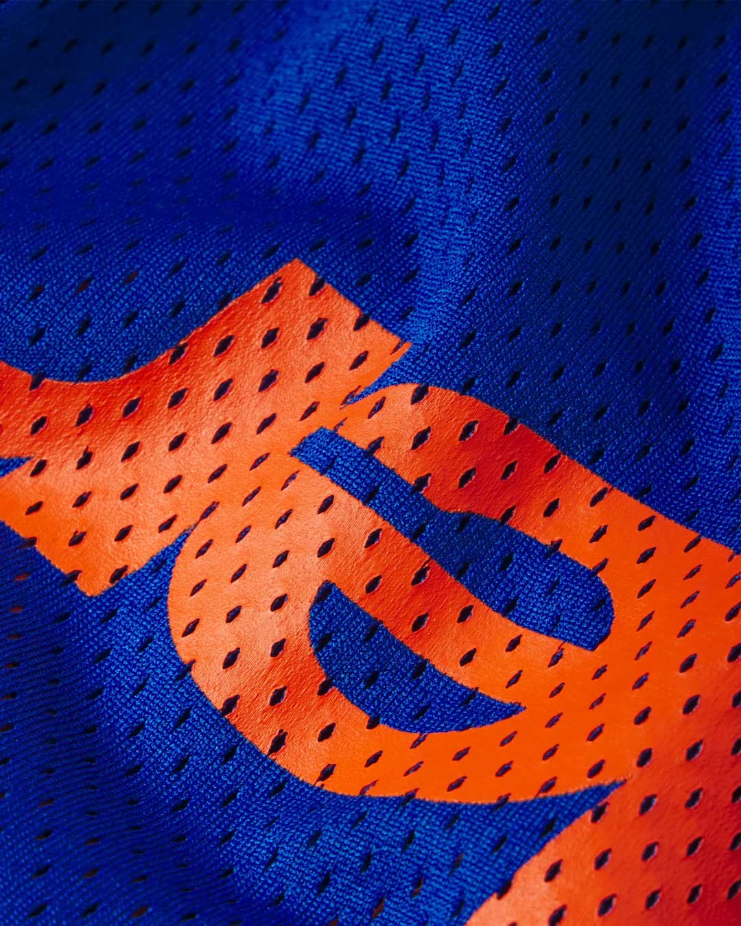 Sp5der Mesh Double Layer Shorts blue, detail view of the perforated blue mesh and double-layer construction