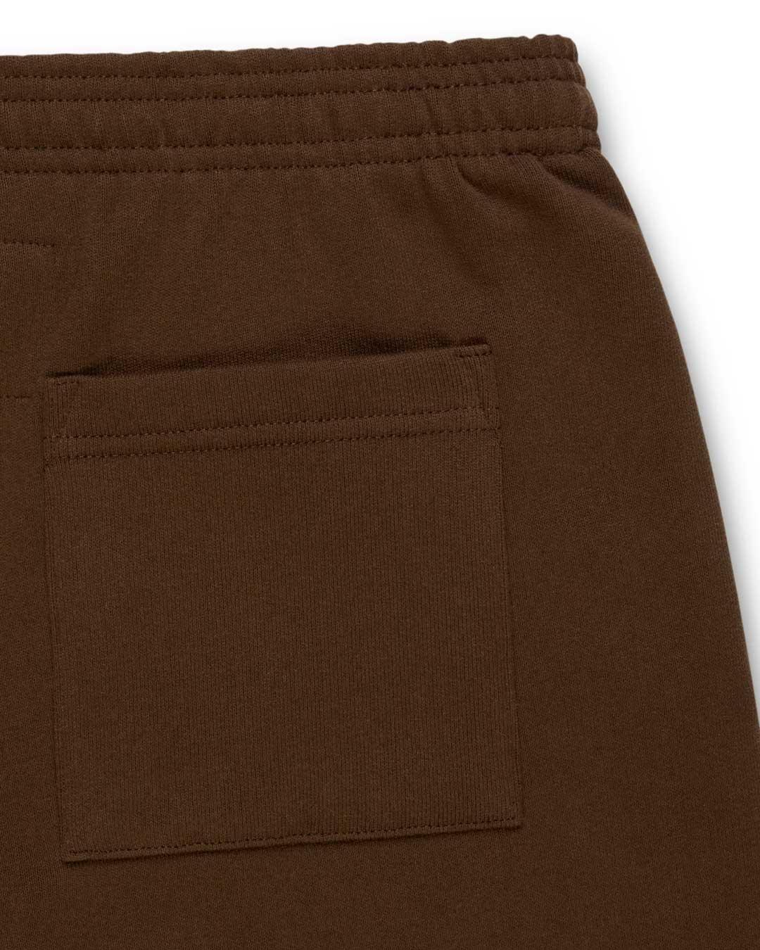 Sp5der OG Web Rhinestone Sweatpants brown, close-up of the back patch pocket and elasticated waistband