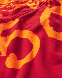 Sp5der Overprint Zip Up Hoodie tangerine orange, close-up of the orange Sp5der print on the red back panel