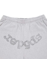 Sp5der Rhinestone Beluga V2 Wide Leg Sweatpants heather grey, close-up of the silver rhinestone sp5der wordmark below the elastic waistband