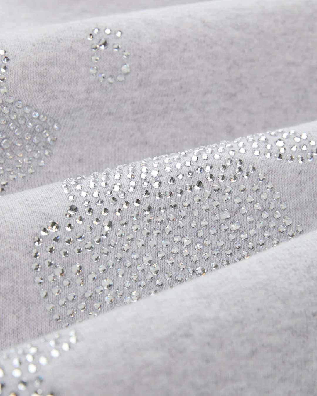 Sp5der Rhinestone Beluga V2 Wide Leg Sweatpants heather grey, macro close-up of the crystal rhinestones set into the fleece