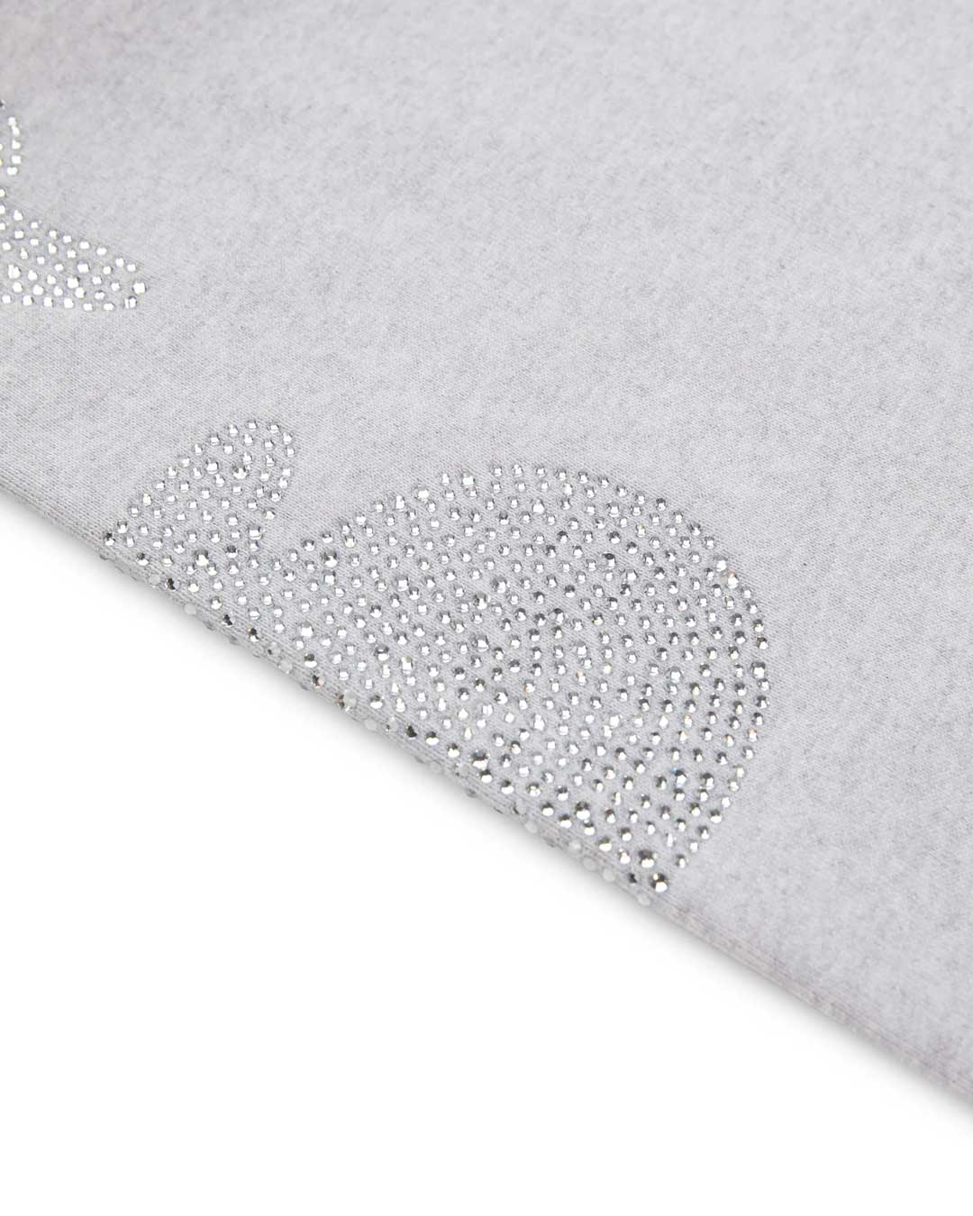 Sp5der Rhinestone Beluga V2 Wide Leg Sweatpants heather grey, angled close-up of a rhinestone motif at the hem