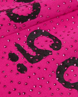 Sp5der Rhinestone OG Logo V2 Wide Leg Sweatpants pink, close-up of the black flocked lettering surrounded by pink rhinestones
