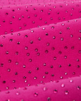 Sp5der Rhinestone OG Logo V2 Wide Leg Sweatpants pink, angled close-up of the rhinestones catching the light across the fabric