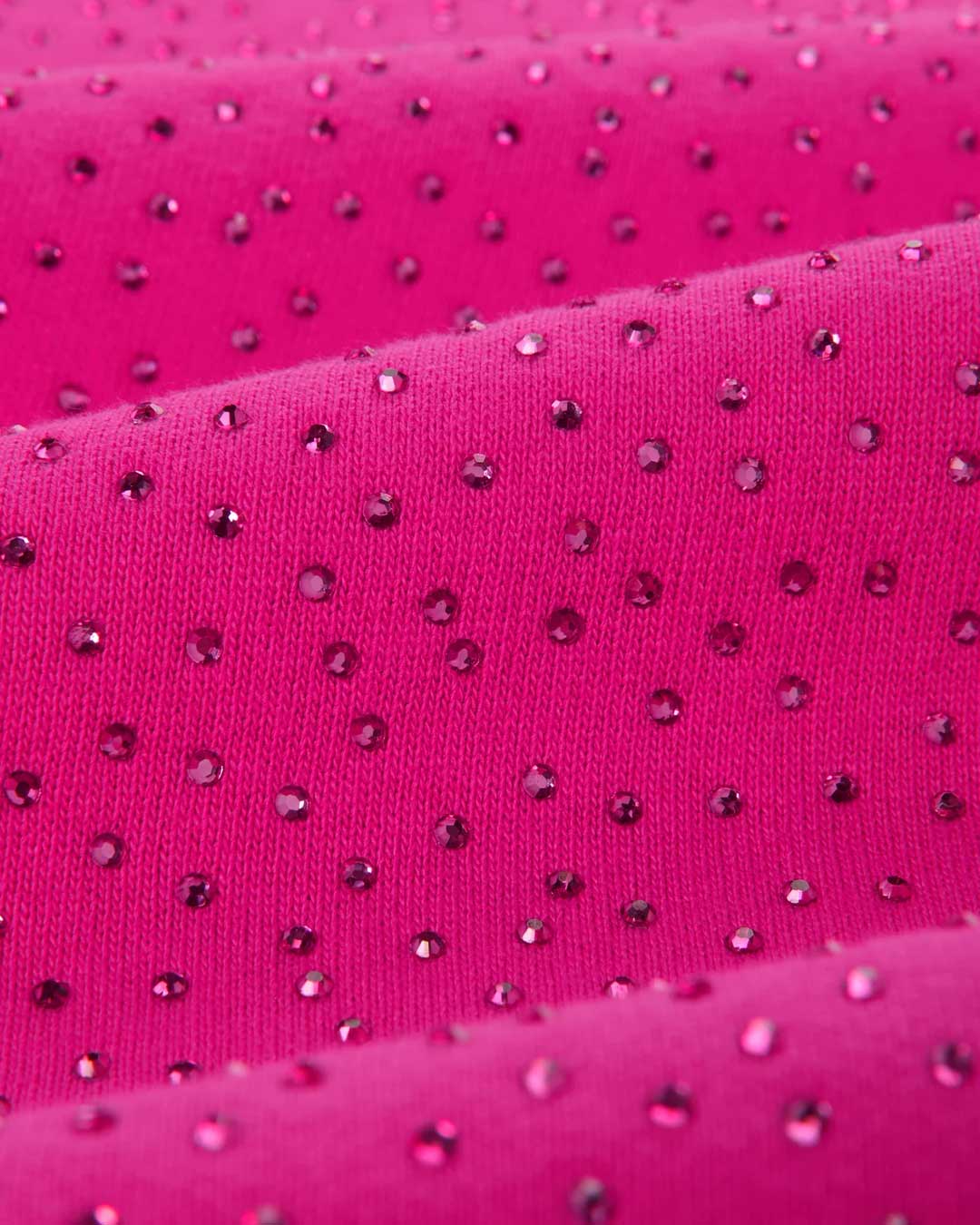 Sp5der Rhinestone OG Logo V2 Wide Leg Sweatpants pink, angled close-up of the rhinestones catching the light across the fabric