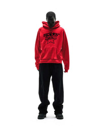 Sp5der Solar Collision Hoodie red worn by a model with black pants, full-length view
