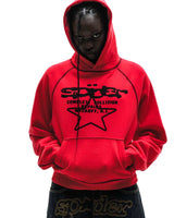 Sp5der Solar Collision Hoodie red worn by a model, closer view of the chest graphic