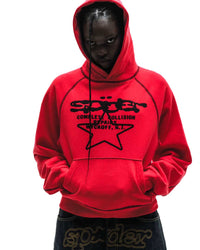 Sp5der Solar Collision Hoodie red worn by a model, closer view of the chest graphic