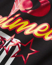 Sp5der Souvenir V2 L/S Tee onyx, close-up of the red and yellow foil script and stars