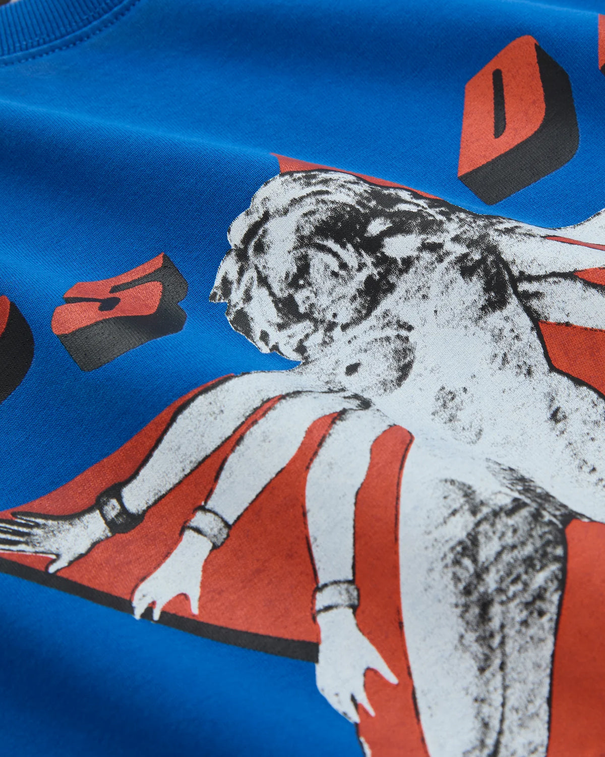 Sp5der Star Girl Tee blue, angled close-up of the printed star graphic on the jersey