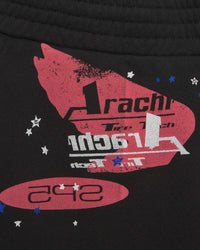Sp5der Tire Tech Sweatshorts black, close-up of the red winged Arachnid Tire Tech badge