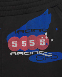 Sp5der Tire Tech Sweatshorts black, close-up of the blue racing wing and 5 5 5 5 pill graphic