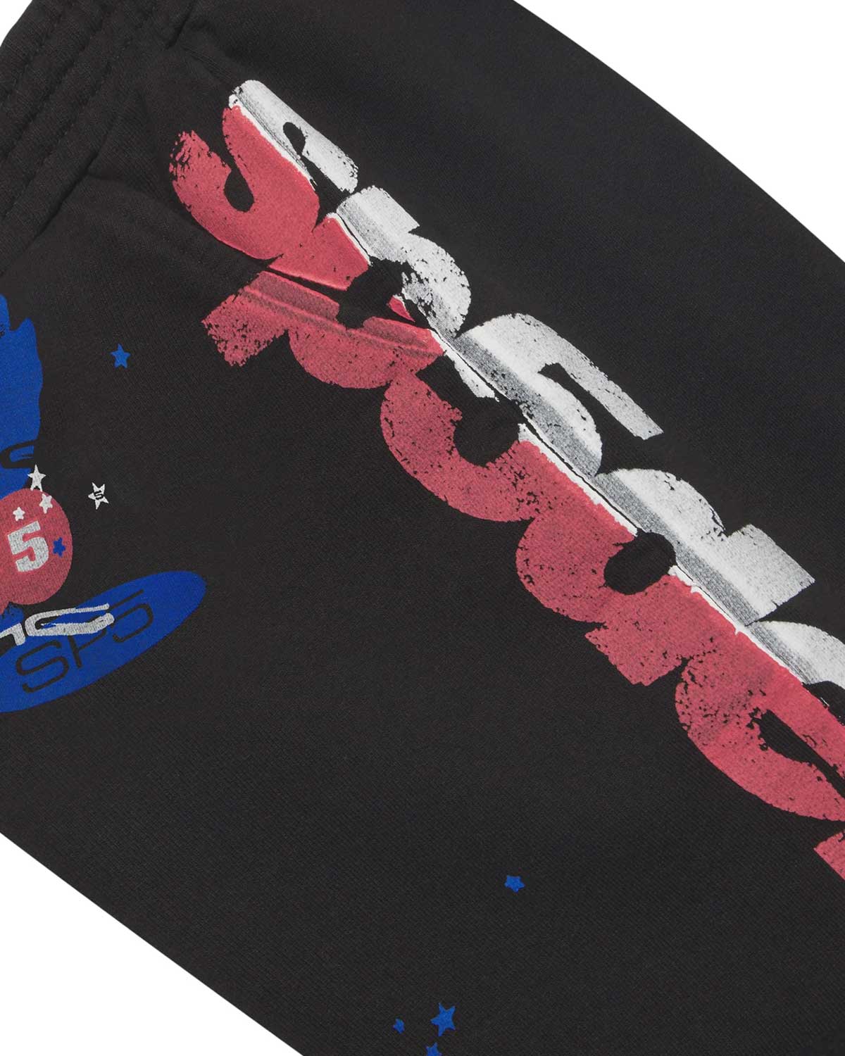 Sp5der Tire Tech Sweatshorts black, close-up of the distressed Sp5der wordmark on the side leg