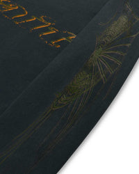 Sp5der Wait L/S Tee black, close-up of the gold chest script and tonal sleeve graphic