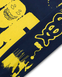 Close-up of a blue and yellow patterned fabric with abstract designs.