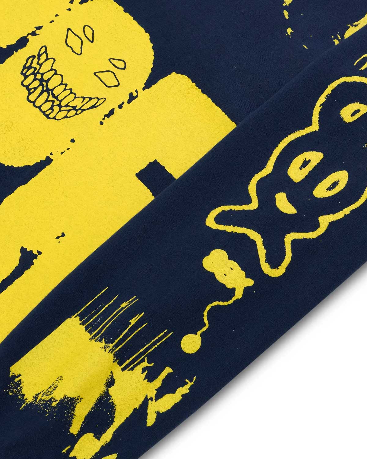 Close-up of a blue and yellow patterned fabric with abstract designs.