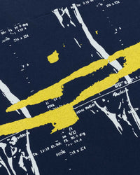 Navy blue fabric with yellow and white abstract patterns