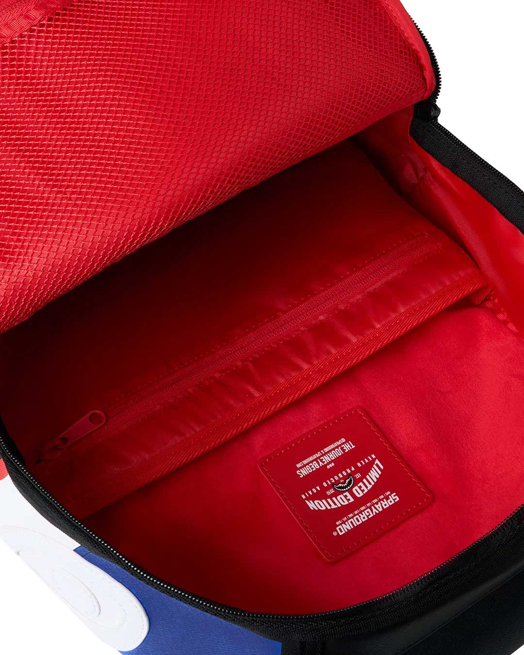 Sprayground First Place Chase Backpack, detail of the red side panel