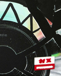 Sprayground Jon Z Burned Disc Backpack black, close-up of the Sprayground logo tab