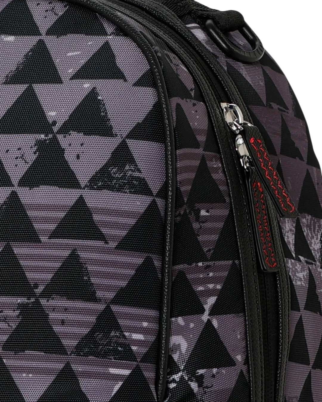 Sprayground Kahuku Niho Mano Backpack, close-up of the painterly triangle print
